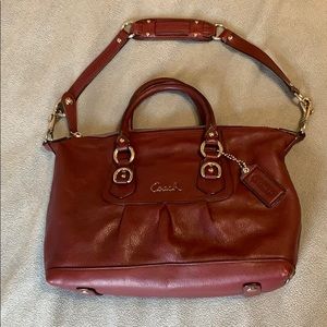 Beautiful leather COACH purse with metal buckles